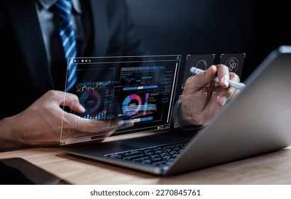 Analyst working with computer in Business Analytics and Data Management System to make report with KPI and metrics connected to database. Corporate strategy for finance, operations, sales, marketing.