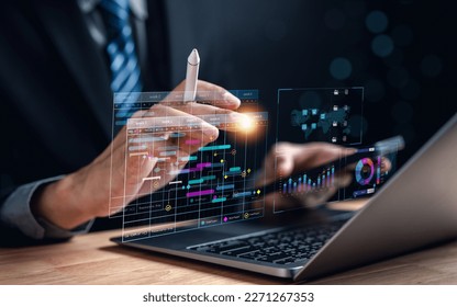 Analyst working with computer in Business Analytics and Data Management System to make report with KPI and metrics connected to database. Corporate strategy for finance, operations, sales, marketing.