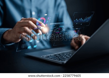 Analyst working with computer in Business Analytics and Data Management System to make report with KPI and metrics connected to database. Corporate strategy for finance, operations, sales, marketing.