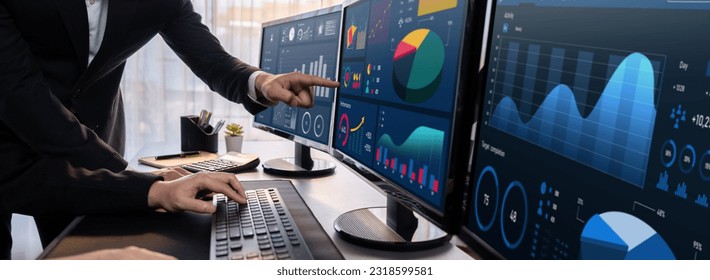 Analyst working on data analysis or BI dashboard on computer monitor. Business team analyzing financial data by Fintech in corporate office for business marketing and strategy planning. Trailblazing - Powered by Shutterstock