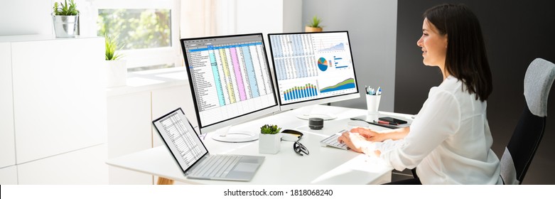Analyst Working With Spreadsheet Business Data On Computer