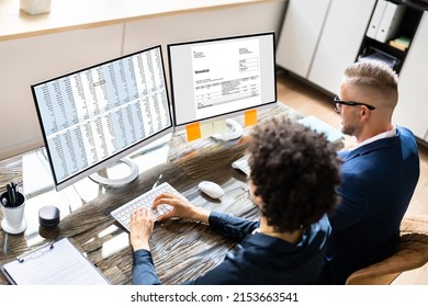 Analyst Working With Spreadsheet On Computer Screen