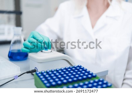 Analytical chemist preparing samples for HPLC analysis to identify and quantify compounds