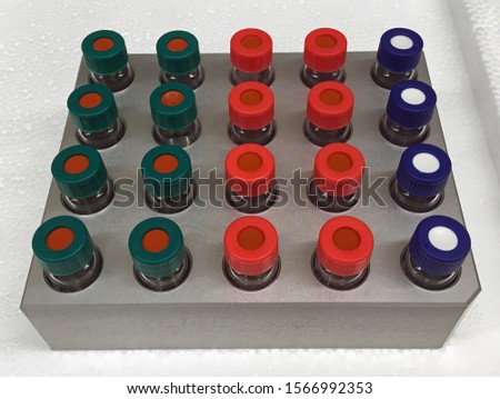 Analytical vials in a rack with samples prepared for analysis by gas and liquid chromatography in a research analytical chemistry laboratory.