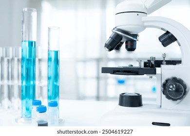 analyze biochemical samples in advanced scientific laboratory. Medical professional use microscope look microbiological developmental of viral. Biotechnology research in science lab. - Powered by Shutterstock