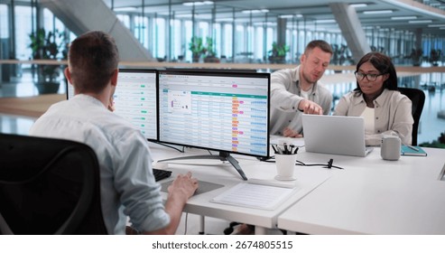 Analyzing Billing Reports With Spreadsheet Software: Diverse Business Team At Work.