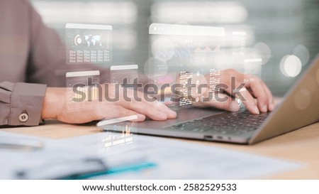 Analyzing Data in a Digital Workspace, Person interacts with laptop displaying advanced analytics and data visualization, integration of technology in modern data analysis