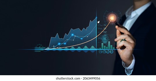 Analyzing and data exchange. Businessman with  pen draws growth graph of business. Business strategy development and growing growth plan. Global business investment. Financial stock exchange. - Shutterstock ID 2063499056