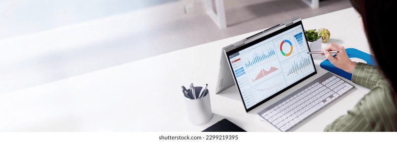 Analyzing Data Graph And Dashboard On Laptop