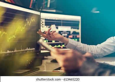 Analyzing data, graphs and reports for investment purposes. Creative teamwork traders. - Powered by Shutterstock - Get 15% off with code: PIKWIZARD15