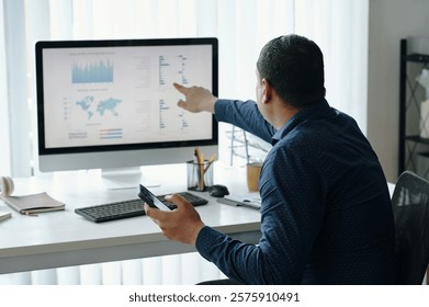 Analyzing Data on Computer in Modern Office Environment