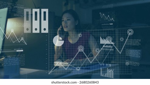 Analyzing data while talking on smartphone at modern office desk, displaying floating graphs. Technology, analytics, business, data, workspace, professional, modern - Powered by Shutterstock - Get 15% off with code: PIKWIZARD15