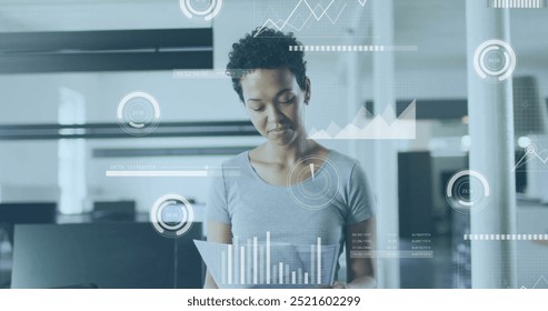 Analyzing documents, businesswoman with data visualization image over office background. analytics, technology, corporate, professional, analysis, information