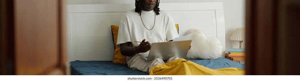 Analyzing Documents While Sitting on Bed With a Laptop