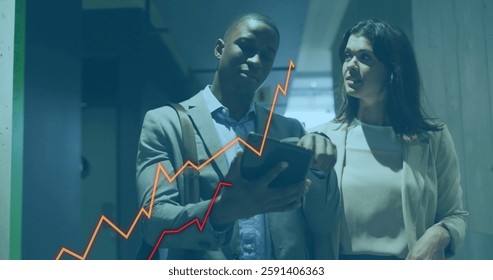 Analyzing financial data on tablet, business professionals with rising graph image. finance, data analysis, growth, investment, strategy, development