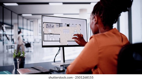 Analyzing House Floor Plan On Digital Tablet: African-American Architect Renovating Hybrid Property For Real Estate Business With Designer. - Powered by Shutterstock