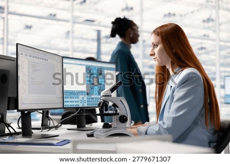 Analyzing integrated circuit, laboratory microscope and woman working in microchip factory RD office at workstation. Inspecting PCB parts, optical equipment and scientist in research facility