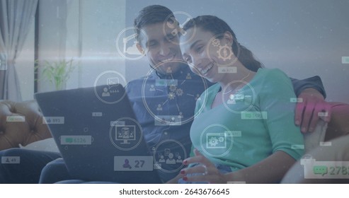 Analyzing interface icons couple using laptop on leather sofa in living room with potted plant. Technology, collaboration, connection, home environment, relaxation, digital, intimacy