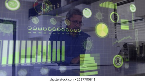 Analyzing senior data analyst reviewing documents and laptop in office, holographic data overlays. Futuristic, technology, business, corporate, professional, analytics, disruption