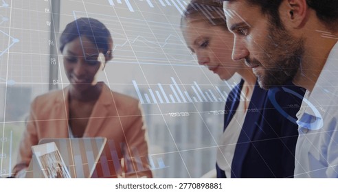 Analyzing three colleagues operating tablet showing charts and gridlines in office, in blazers. Collaboration, analytics, data, graphs, dashboard, modern, urban