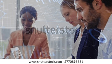 Analyzing three colleagues operating tablet showing charts and gridlines in office, in blazers. Collaboration, analytics, data, graphs, dashboard, modern, urban