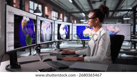 Analyzing Weather Data To Predict Climate Change Disasters In Office. Woman Using Computer To Track Hurricane