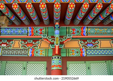 Anam-dong, Seongbuk-gu, Seoul, South Korea - May 2, 2022: Low Angle View Of Dancheong(traditional Multicolored Paintwork) With Flower Pattern Under The Eaves Of A Building At Botasa Temple
