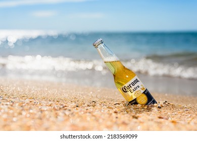 Anapa - Russia, July 2022: A Bottle Of Cold Beer Corona Extra On The Beach.