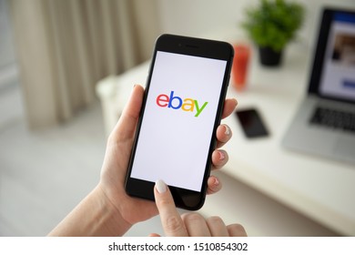 Anapa, Russia - July 21, 2019: Woman holding iPhone 8 Plus with Internet shopping service eBay on the screen. iPhone was created and developed by the Apple inc.