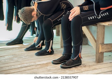 Anapa, Russia - June 20, 2019: Child Girl Puts On A Wetsuit And Prepares To Dive. Girl Scuba Diver