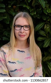 Anapa, Russian Federation - 2 May 2018,  Portrait Of Blond Girl In Park.  Teenager Girl In Eyeglasses Outdoors 