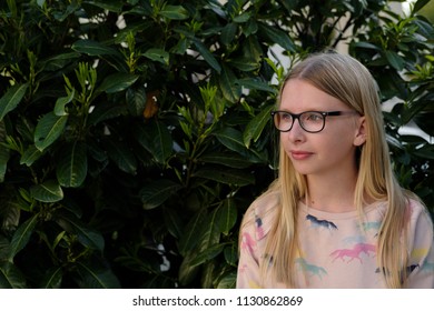 Anapa, Russian Federation - 2 May 2018,  Portrait Of Blond Girl In Park.  Teenager Girl In Eyeglasses Outdoors 