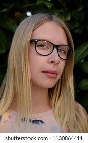 Anapa, Russian Federation - 2 May 2018,  Portrait Of Blond Girl In Park.  Teenager Girl In Eyeglasses Outdoors 