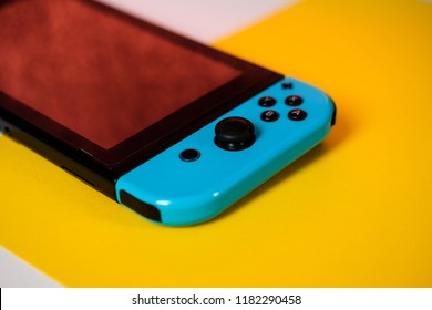 Anapa, Russian Federation - 7 September 2018,  Nintendo Switch Console. Handheld Nintendo Switch On Yellow Background