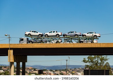 ANAPOLIS GOIAS BRAZIL - NOVEMBER 28 2020:  A Stork Truck Full Of Cars On An Overpass With Blue Sky In The Background.