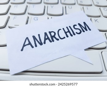 Anarchism writting on table background.