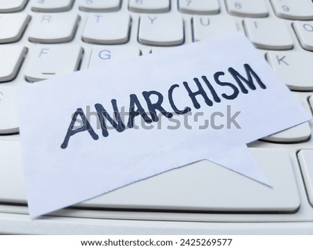 Anarchism writting on table background.