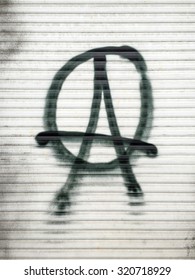 Anarchist Symbol Spray-painted On A Shutter In Berlin, Germany.