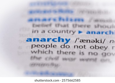 Anarchy word in a dictionary. Selective focus, close up