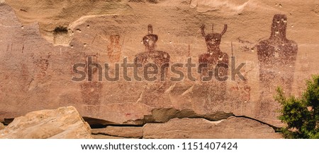 Ancestral Puebloan or Anasazi petroglyphs of strange anthropomorph figures, often referred to as 