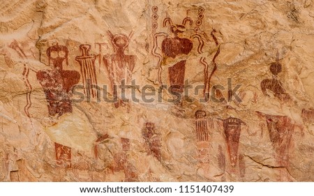 Ancestral Puebloan or Anasazi petroglyphs of strange anthropomorphic figures, often referred to as 