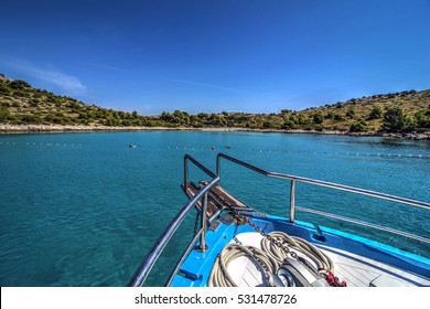Anchor boat on blue lagoon beach.
Front of boat in national park Kornati - Croatia