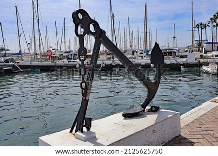 An anchor and chain artwork at the marina in Estepona in Spain