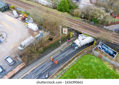 Anchor Road, Stoke On Trent, Staffordshire - 25th February 2020 - A UK Mail Lorry Crashes Into A Railway Bridge On The Busy City Road, HGV Lorry Crash, Large Haulage Vehicle Stuck Under Bridge