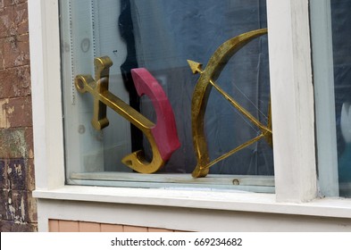 Anchor statue displayed in store window 