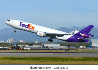 Anchorage, AK / USA - September 12 2018: Fedex McDonnell Douglas MD-11 Departing The Cargo Hub Of Ted Stevens Airport In Alaska. Aircraft MD11 Registered As N591FE Carrying Tons Of Cargo.