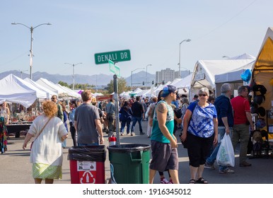 Anchorage, Alaska, United States – August 10, 2019: Alaskans And Tourists Shop At The Alaska Farmer's Market In Downtown Anchorage On A Hot Summer Day; Shoppers At Different Tents Of Local Products.