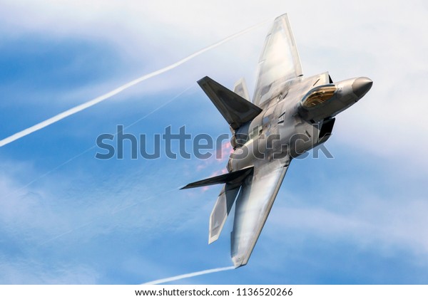 ANCHORAGE,\
ALASKA / USA - June 30, 2018: A United States Air Force F-22 Raptor\
performs at the 2018 Arctic Thunder\
Airshow.