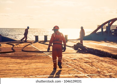 Anchor-handling Tug Supply AHTS Vessel Crew Preparing Vessel For Static Tow Tanker Lifting. Ocean Tug Job.AB And Bosun On Deck.