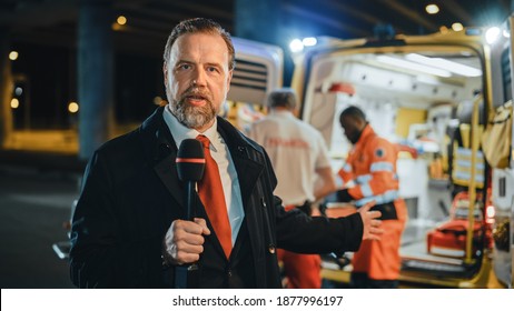 Anchorman Reporting Breaking News Live From a Traffic Accident. Newsreader Delivers Journalistic Program on Television. EMS Paramedics Helping Injured Patient to Get into Ambulance on a Stretcher. - Powered by Shutterstock